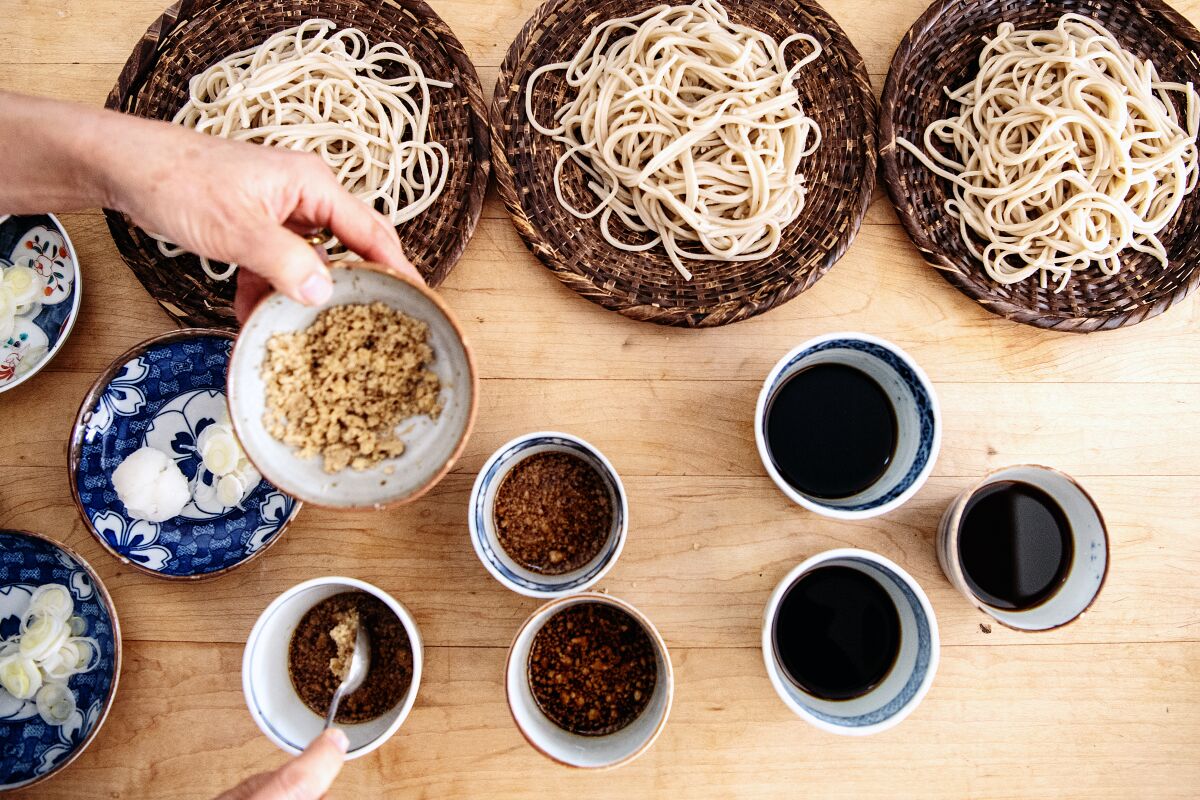 Bowls of fresh, chilled soba noodles with dipping sauces