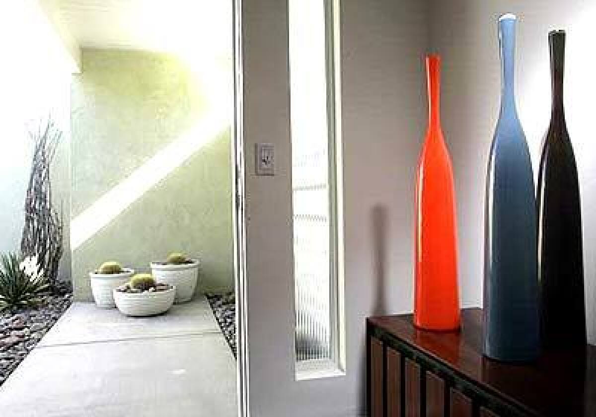 The tall, brightly colored bottles in Brad Cooks Palm Springs home create a midcentury Modern mood as soon as you step through the door.