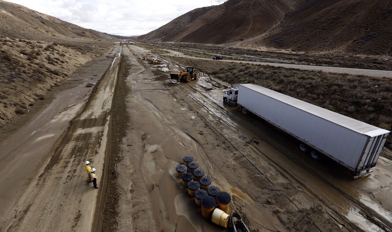A big-rig sits stranded on California 58 in the Tehachapi area, where the road remains closed after torrential rains pummeled the area.