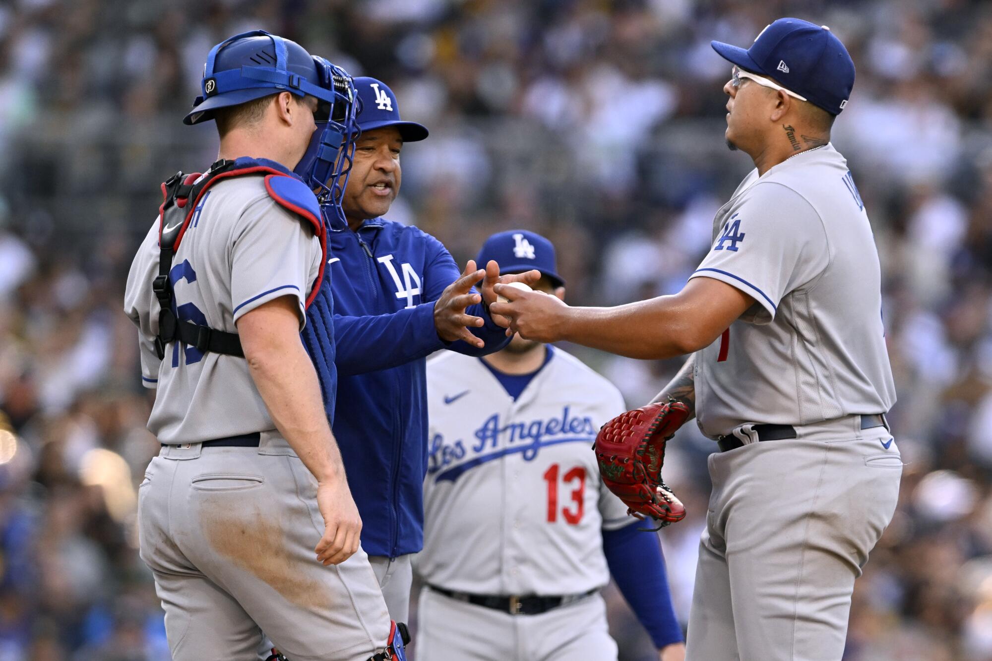 Dodgers manager Dave Roberts pulls Julio Urías from a game against the San Diego Padres on May 7.
