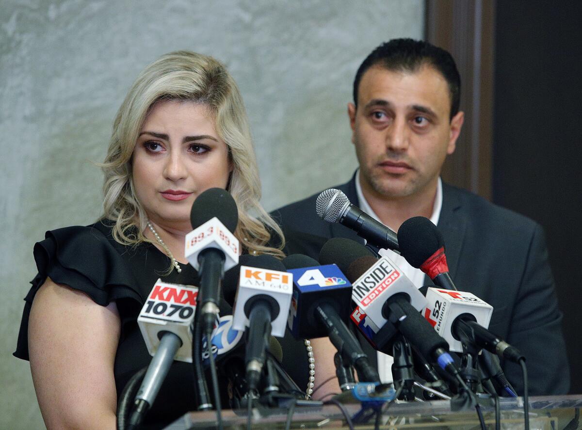 Anni and Ashot Manukyan listen to a question during a press conference to talk about their claim of negligence against the Los Angeles-based CHA Fertility Center at La Plaza de Cultura y Artes in Los Angeles on July 10.