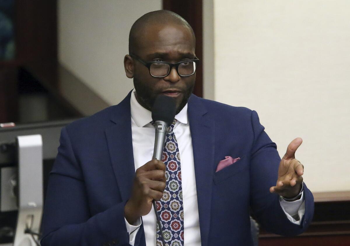 FILE - State Rep. Shevrin Jones, D-West Park, asks a question concerning the medical marijuana bill during session Wednesday, March, 13 2019, in Tallahassee, Fla. A bill pushed by Republican Florida Gov. Ron DeSantis that would prohibit public schools and private businesses from making white people feel “discomfort” when they teach students or train employees about discrimination in the nation's past received its first approval Tuesday, Dec. 18, 2022. “This bill's not for Blacks, this bill was not for any other race. This was directed to make whites not feel bad about what happened years ago,” said Jones. (AP Photo/Steve Cannon, File)