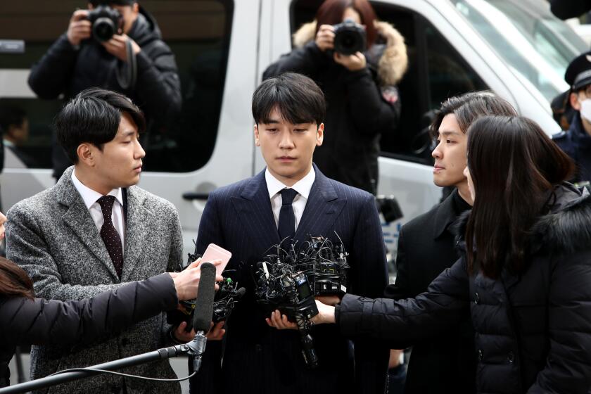SEOUL, SOUTH KOREA - MARCH 14: Seungri, formerly a member of South Korean boy band BIGBANG is seen arriving at a Seoul Metropolitan Police Agency on March 14, 2019 in Seoul, South Korea. Seungri of South Korean boy band BIGBANG appeared at the police station on Thursday to be questioned over the charges of supplying prostitution services. (Photo by Chung Sung-Jun/Getty Images)