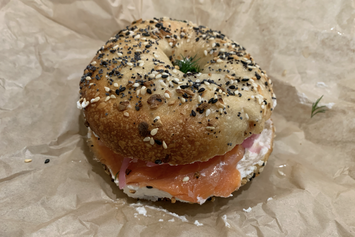 An everything bagel sandwich with smoked salmon and cream cheese.