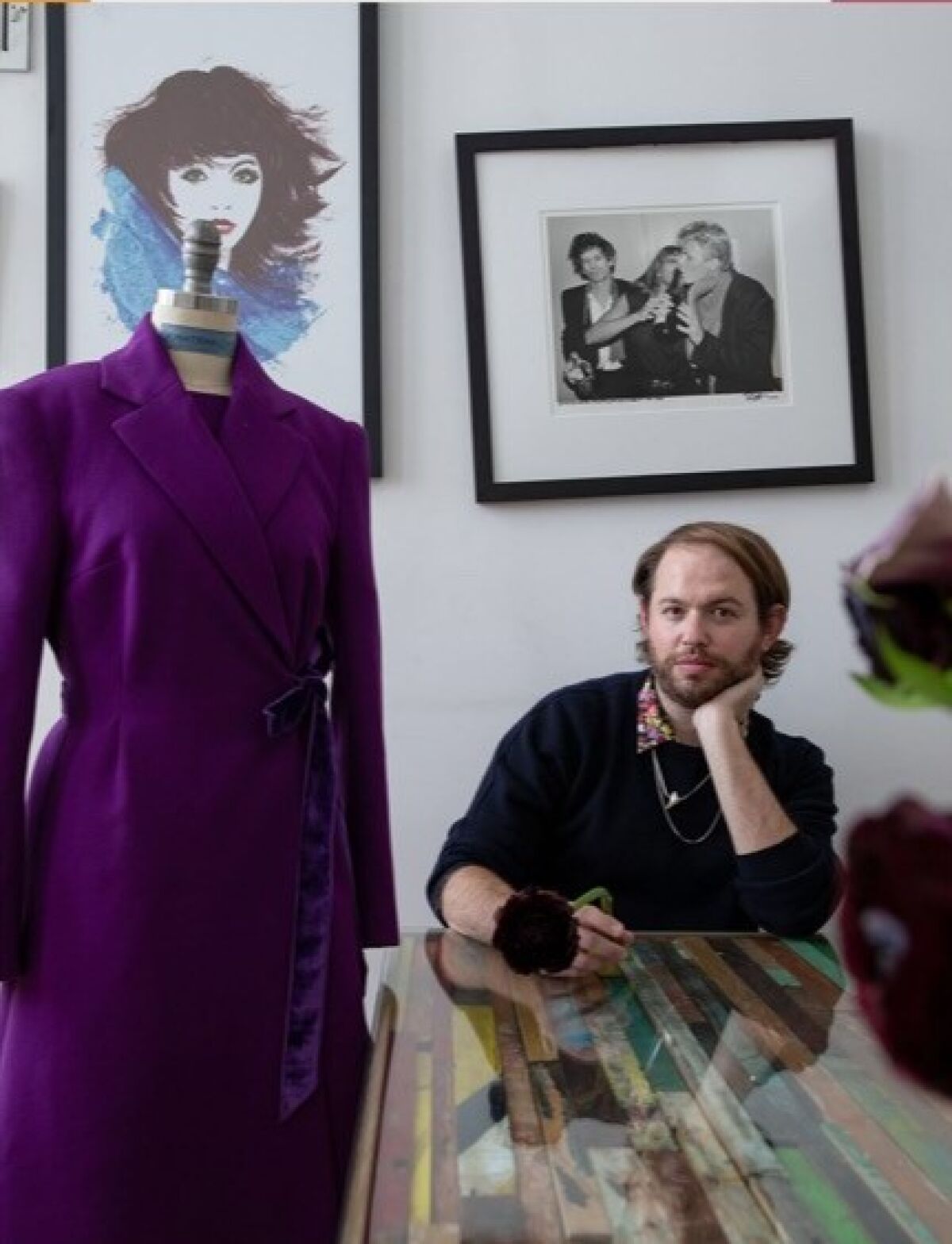 La Jolla native Jonathan Cohen and the purple coat he designed that was worn by first lady Jill Biden.