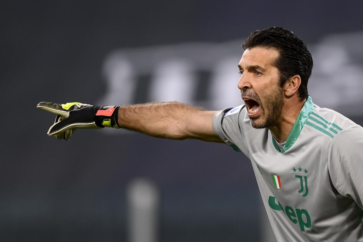 FILE - Juventus' Gianluigi Buffon shouts instructions to his teammates during an Italian Serie A soccer match on April 7, 2021. Former Italy goalkeeper Gianluigi Buffon has renewed his contract with second-division Parma through the 2023-24 season -- meaning he plans to play until he’s at least 46. (Fabio Ferrari/LaPresse via AP)
