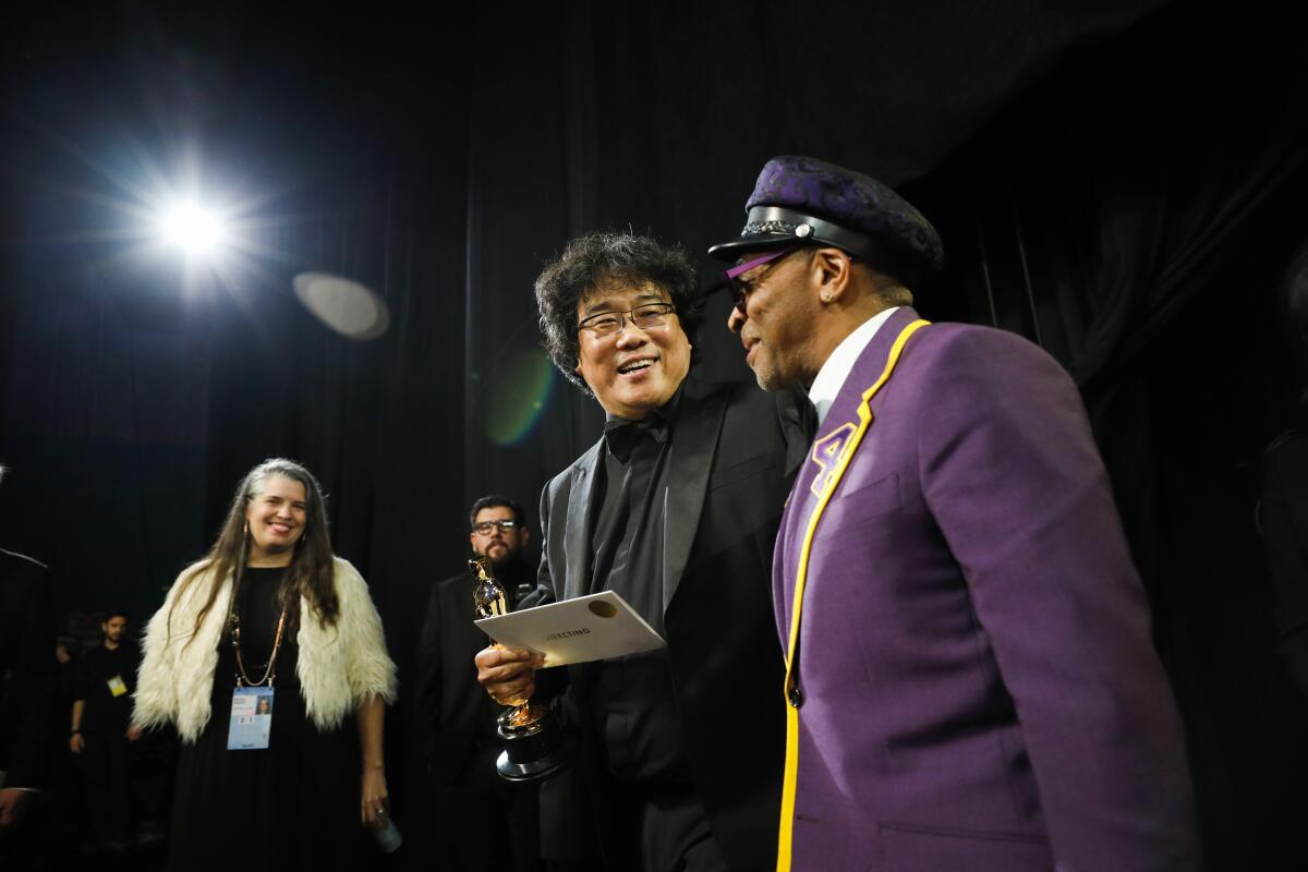 Bong Joon Ho, whose film "Parasite" took home Oscars for best picture, international film, director and original screenplay, backstage with Spike Lee.