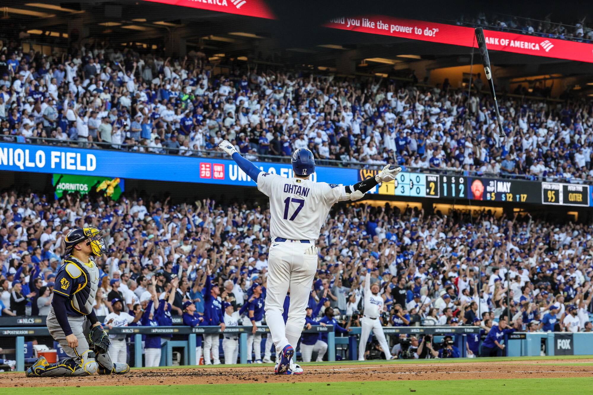 Shohei Ohtani tosses his bat aft hitting a three-run location tally against the Milwaukee Brewers.
