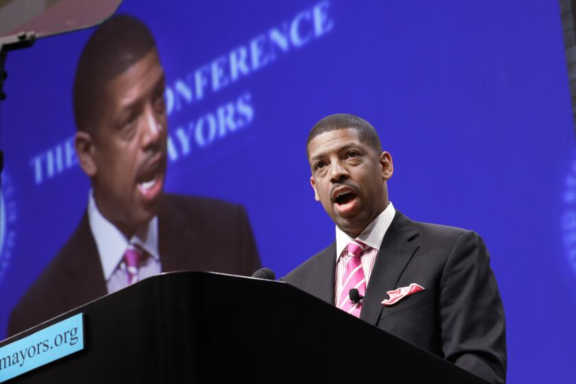 Sacramento Mayor Kevin Johnson, president of the U.S. Conference of Mayors, speaks before a panel discussion about sports and race relations in Dallas in June.