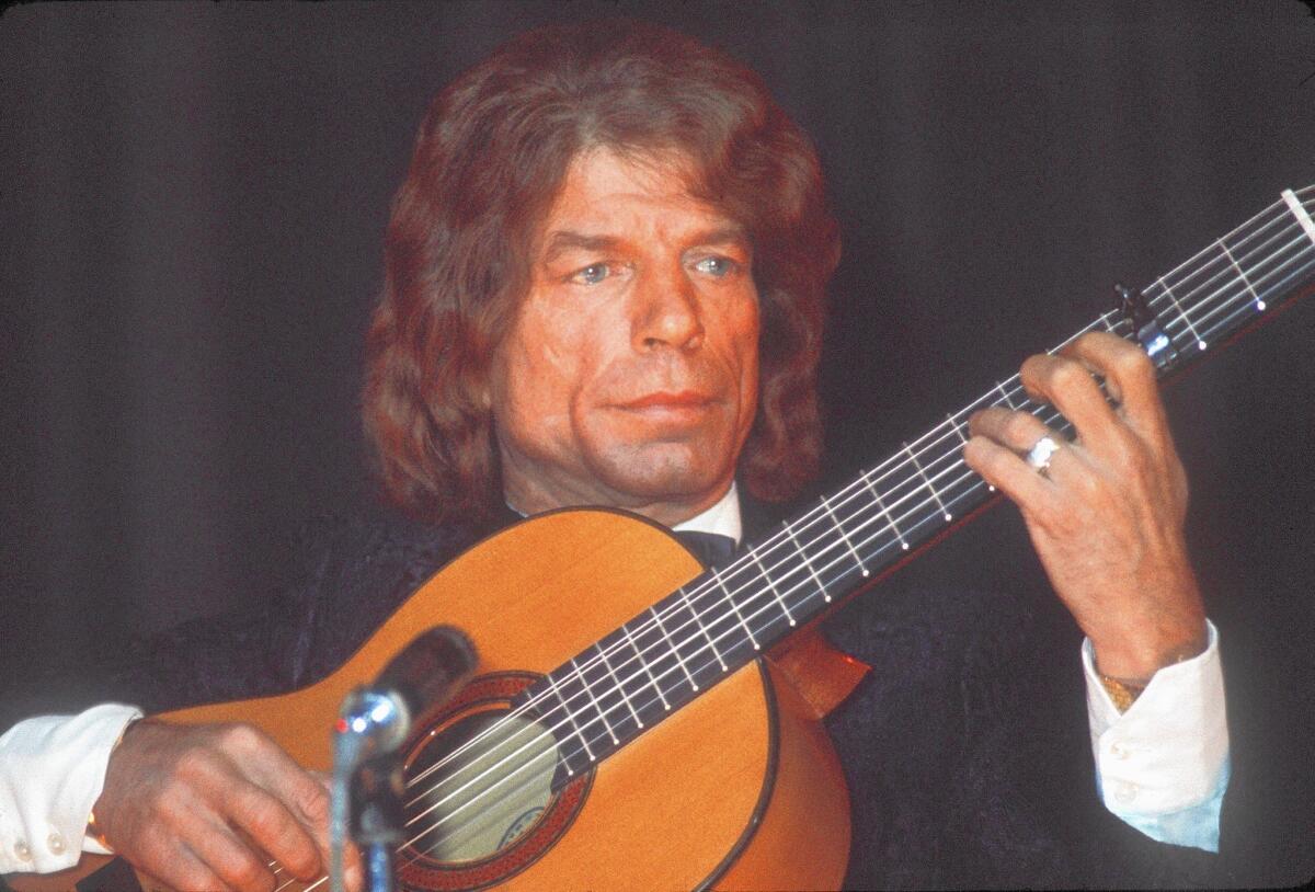 French flamenco guitarist Manitas de Plata, shown performing in Paris in 1969, has died at 93.