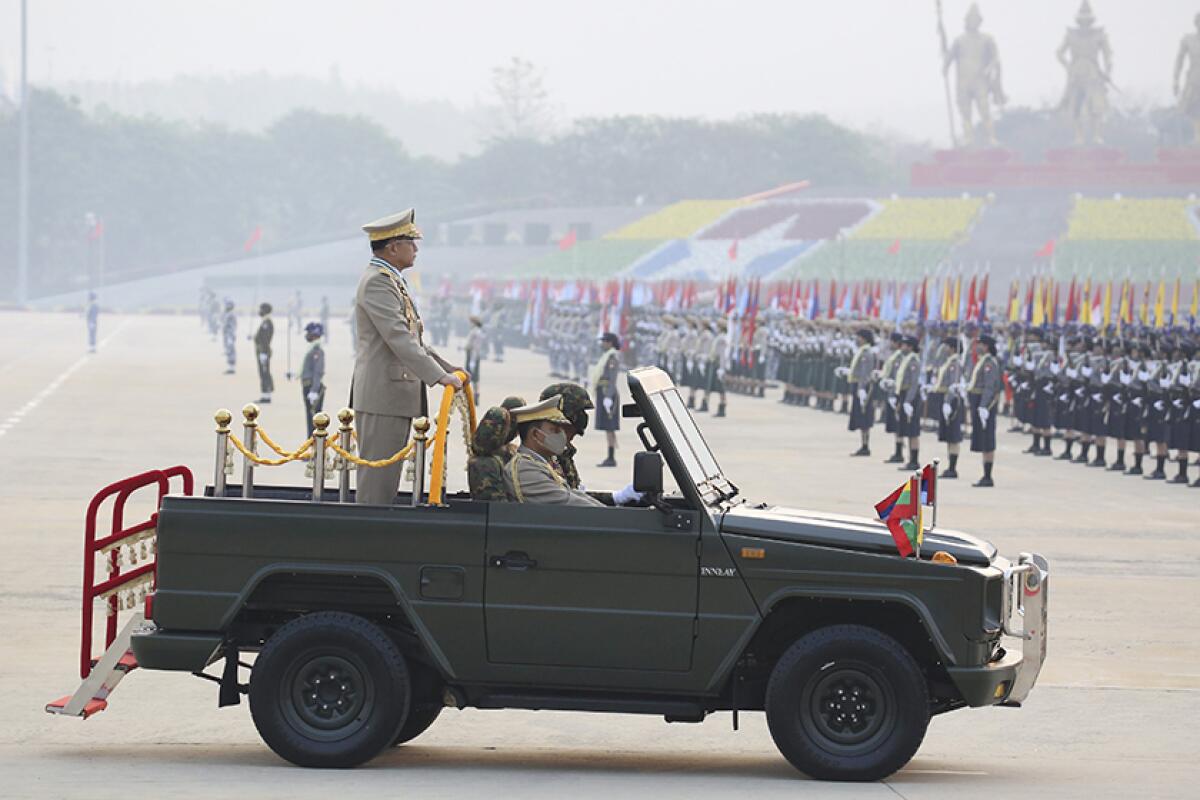 Myanmar's military chief, Senior Gen. Min Aung Hlaing, reviews troops during Armed Forces Day on Saturday.