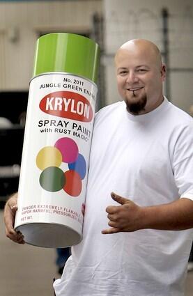 Mark Demonaco from Montclair carrys a metal sculpture replica of a 1968 Krylon spray can. Although is doesn't have paint inside, it does have a metal ball that makes the rattle sound of a shaking spray can.