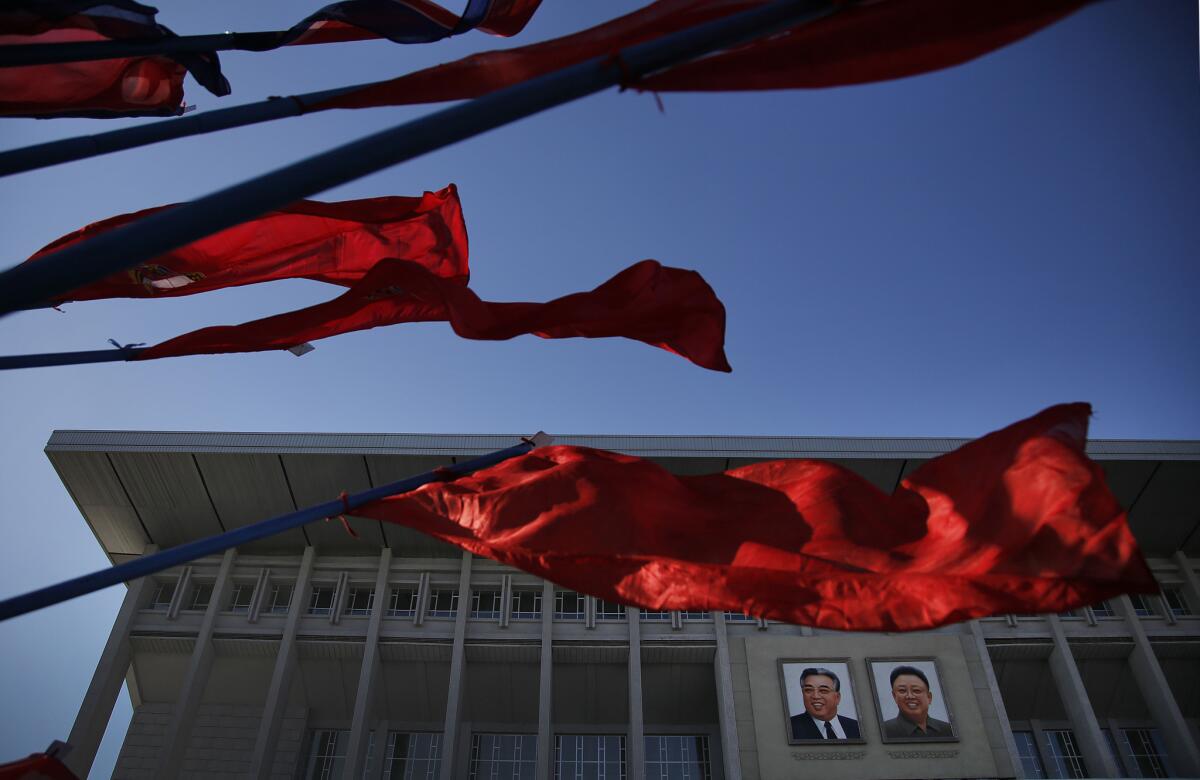 Portraits of the late leaders Kim Il Sung, left, and Kim Jong Il at at the entrance of the Pyongyang Indoor Stadium in North Korea last month.