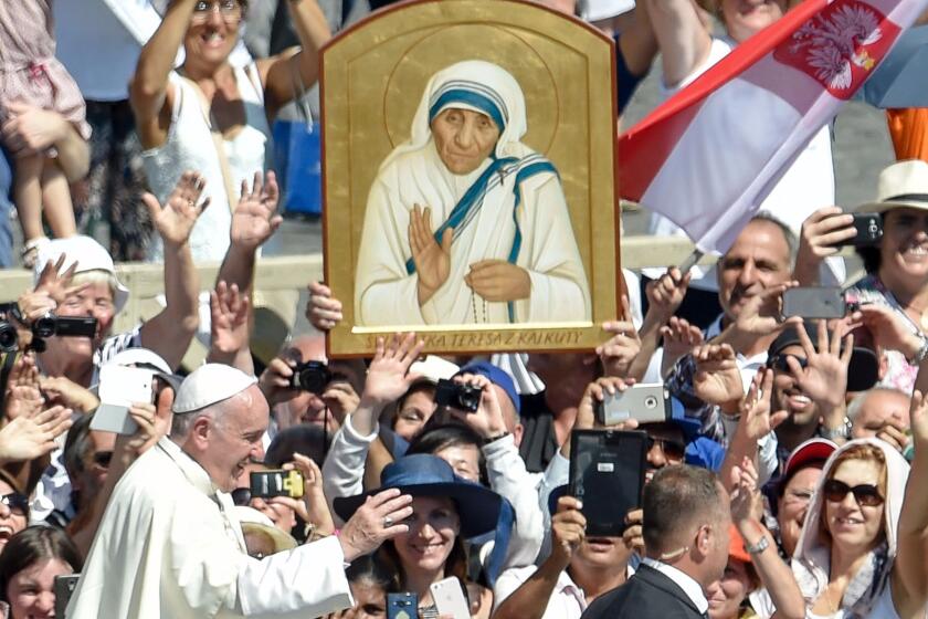 Pope Francis leaves after the canonization of Mother Teresa in St. Peter's Square in the Vatican.