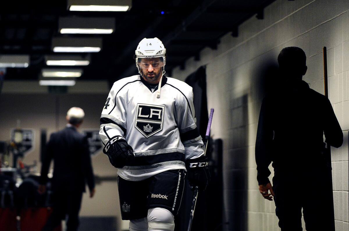 Justin Williams walks out of the Kings locker room before taking the ice for a 2014 playoff game.