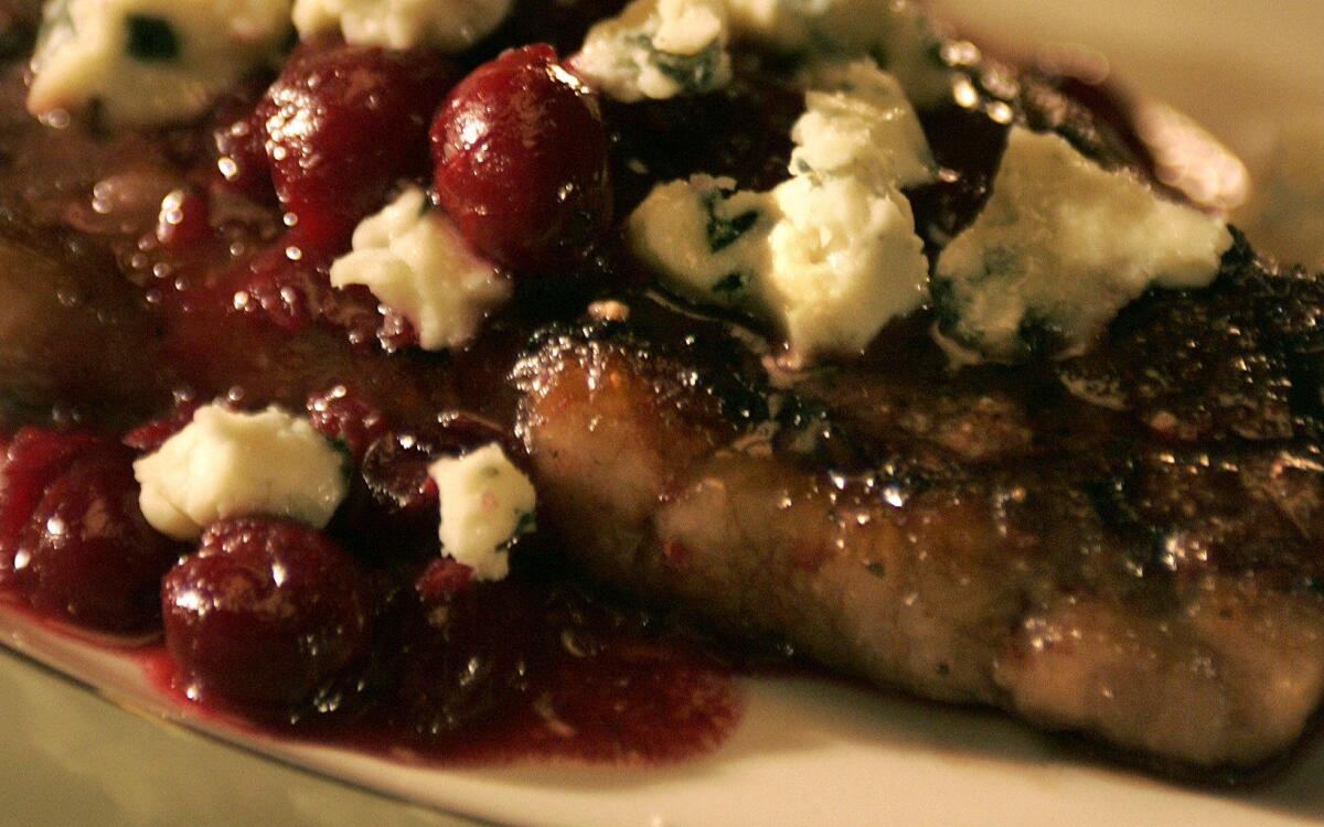 Grilled steaks with blue cheese and cranberry confit