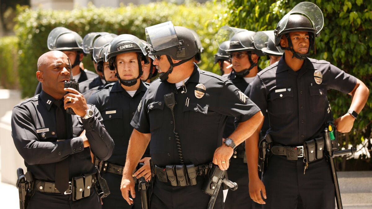 LAPD officers at a protest near City Hall on Tuesday, July 12.