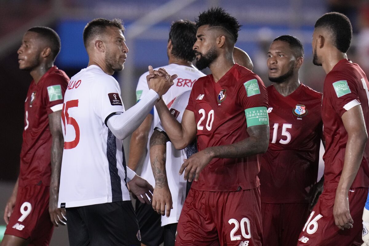 Costa Rica's Francisco Calvo, left, and Panama's Anibal Godoy shake hands after there 0-0 draw in a qualifying soccer match for the FIFA World Cup Qatar 2022 in Panama City, Thursday, Sept. 2, 2021. (AP Photo/Arnulfo Franco)