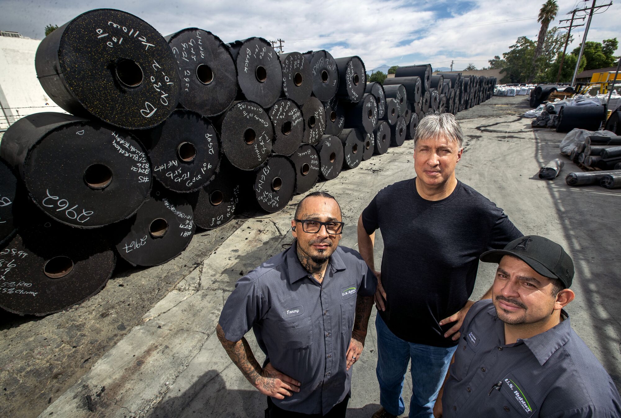 Thomas Urioste, 50, left, and Carlos Arceo, 39, right, former felons and employees at U.S. Rubber Recycling.