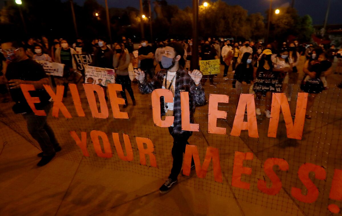 Protesters march to downtown Los Angeles in October to demand accountability for pollution from the Exide plant.