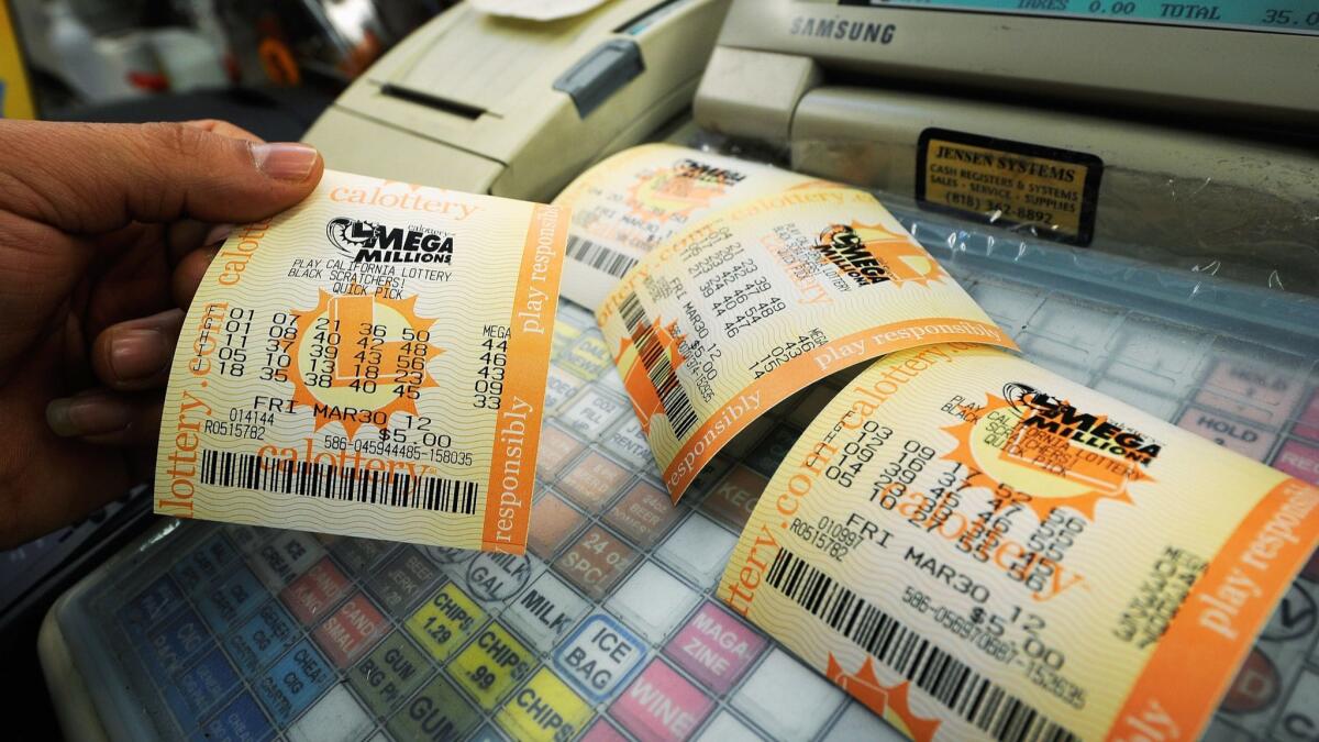 Mega Millions lottery tickets sit on a cash register in Covina in 2013.