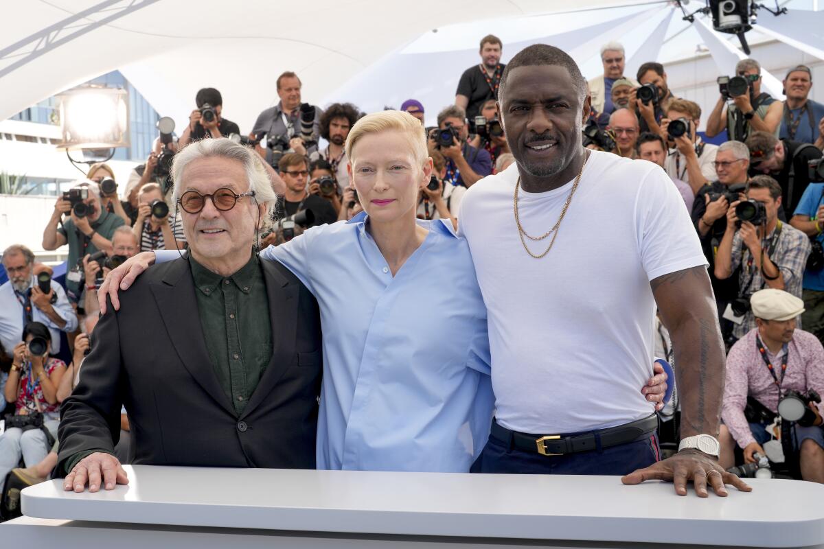 FILE - Director George Miller, from left, Tilda Swinton, and Idris Elba pose for photographers at the photo call for the film "Three Thousand Years of Longing" at the 75th international film festival, Cannes, southern France, on May 21, 2022. (AP Photo/Petros Giannakouris, File)