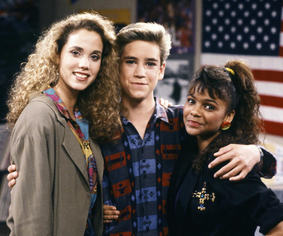 "Saved by the Bell" stars pose for a photo.