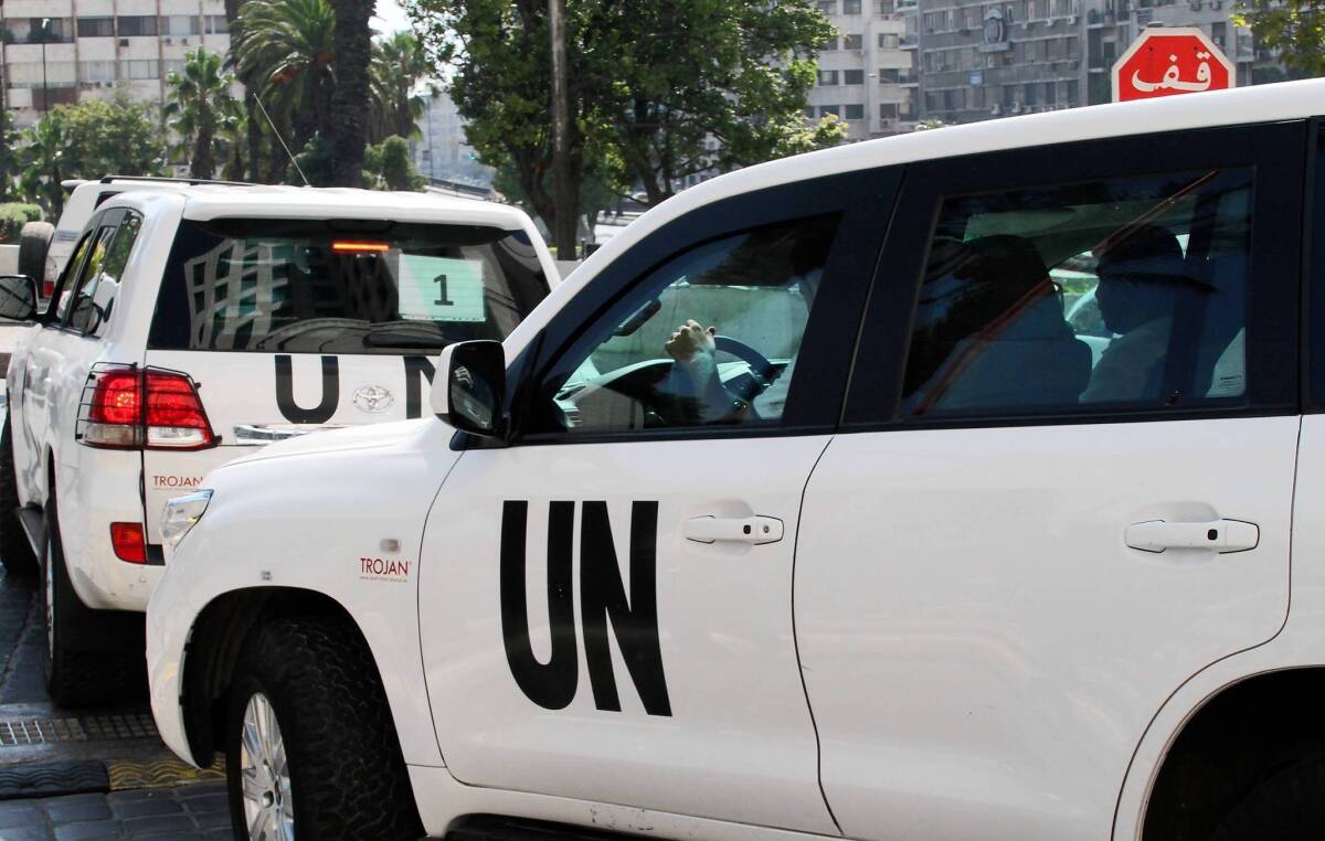 United Nations inspectors leave a hotel in Damascus, the Syrian capital, for the site of a suspected chemical attack on their last day of inspections.