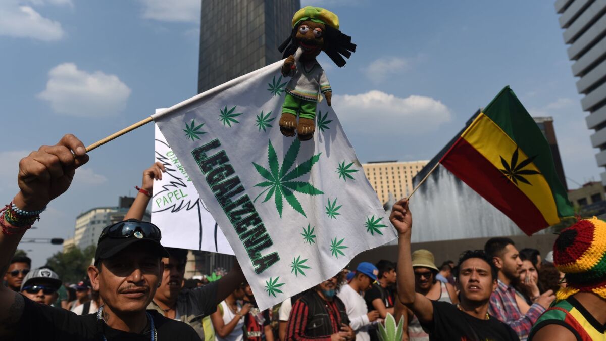 Activists march along Mexico City's Reforma avenue in May to demand the decriminalization of marijuana.