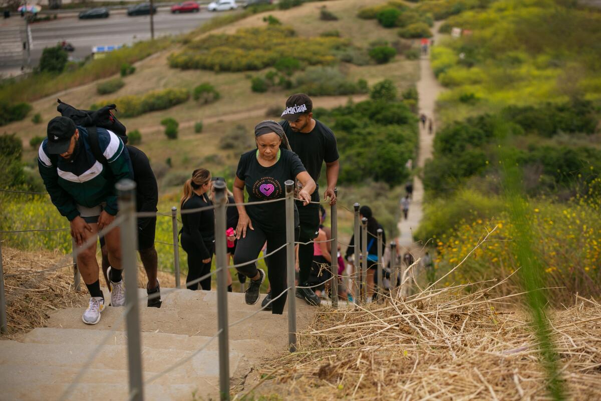 Hikers on the Culver City Stairs at the Baldwin Hills Scenic Overlook.