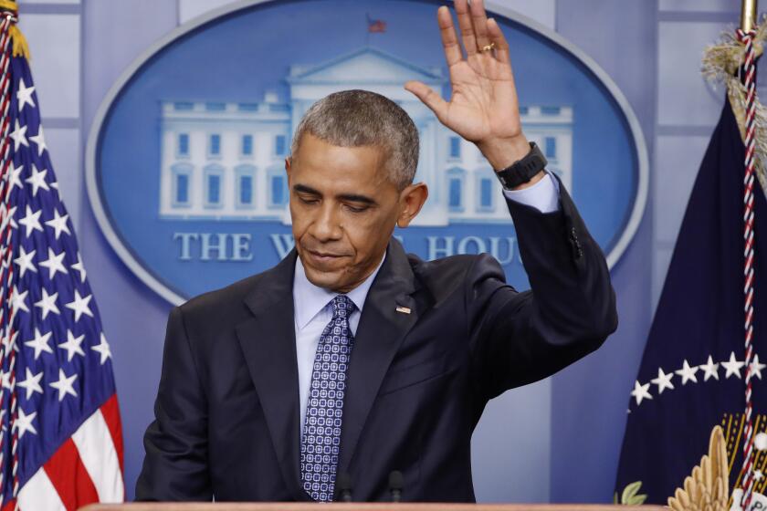 Former President Obama waves at the conclusion of his final presidential news conference, Wednesday, Jan. 18, 2017, in the briefing room of the white House in Washington.