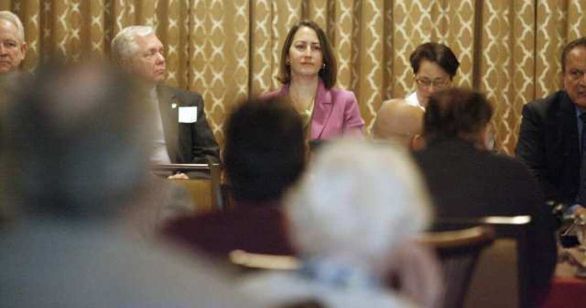 Council candidate Laura Friedman, center, and other candidates listen to a question during a debate, which took place at Oakmont Country Club in Glendale.