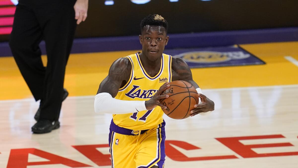 Los Angeles Lakers guard Dennis Schroder (17) passes the ball during the second quarter.