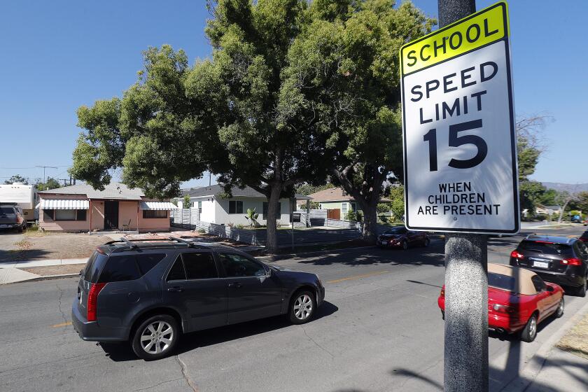 A newly installed school-zone 15-mile-per-hour speed limit sign near Bret Harte Elementary School on Jeffries Avenue in Burbank on Friday, August 9, 2019. For the last several months the City of Burbank have placed near speed limit signs around 24 schools, lowering it from 25 mph to 15 mph. Additionally they also installed in new crosswalks and upgrading existing ones with high visibility markers. The city also installed 12 new all-way stop crossings. The changes come in an effort to increase pedestrian and student safety ahead of the new school year and to encourage drivers to go through school zones at a lower rate of speed.