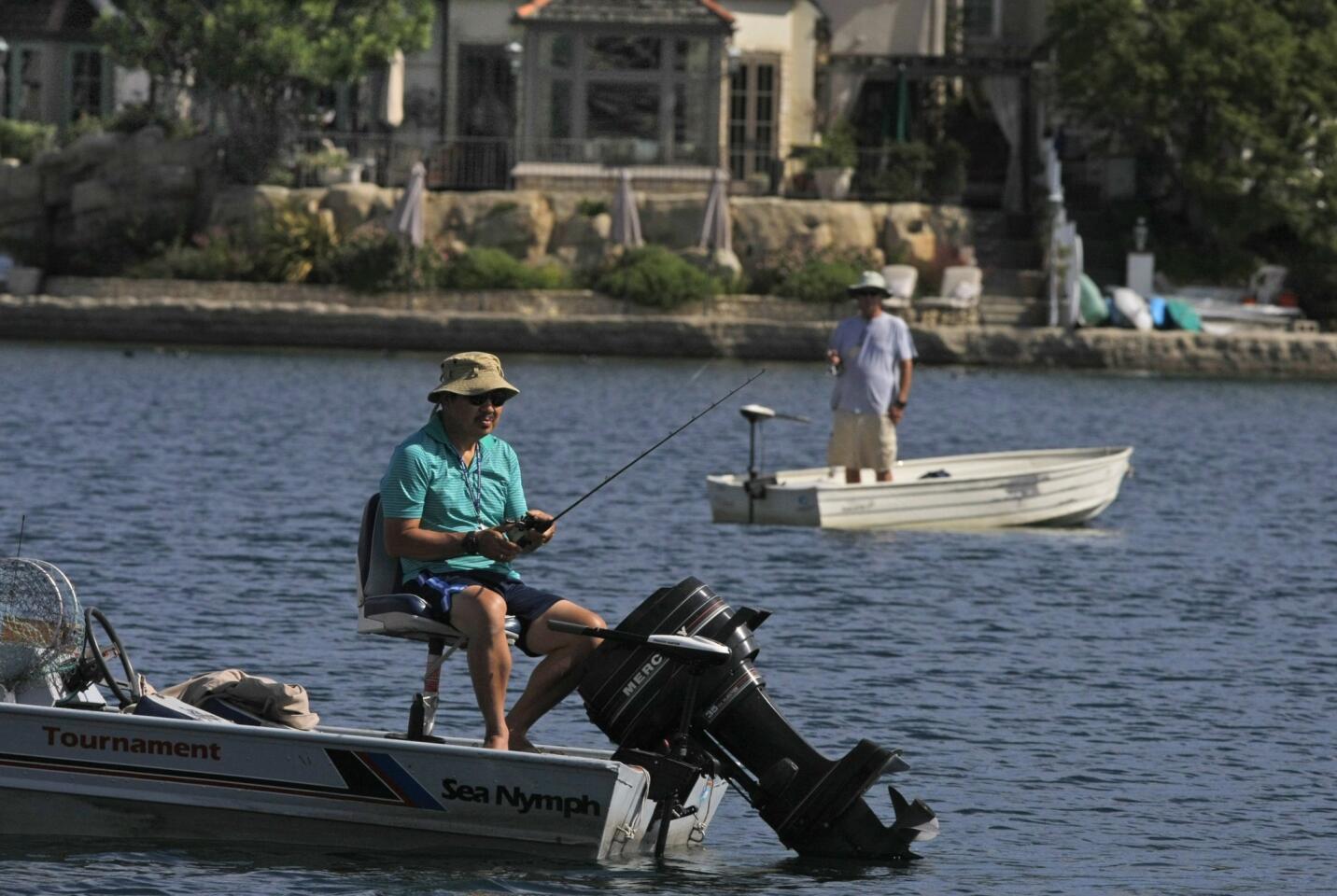 Fishermen try their luck in Lake Mission Viejo, a manufactured body of water in south Orange County.