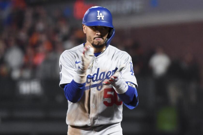 San Francisco, CA - October 14: Los Angeles Dodgers' Mookie Betts celebrates after a single during the eighth inning.