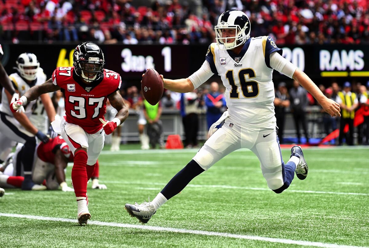 Rams quarterback Jared Goff scores on a touchdown run