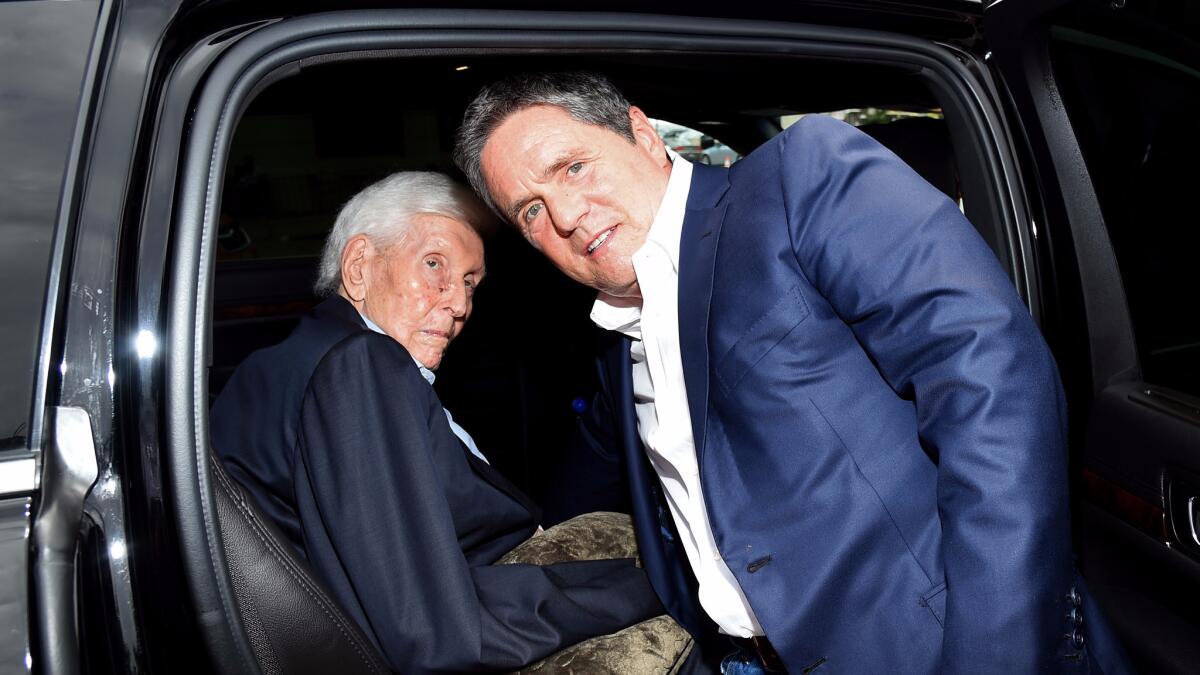 Viacom controlling shareholder Sumner Redstone, left, and Paramount CEO Brad Grey at a movie premiere in 2014.