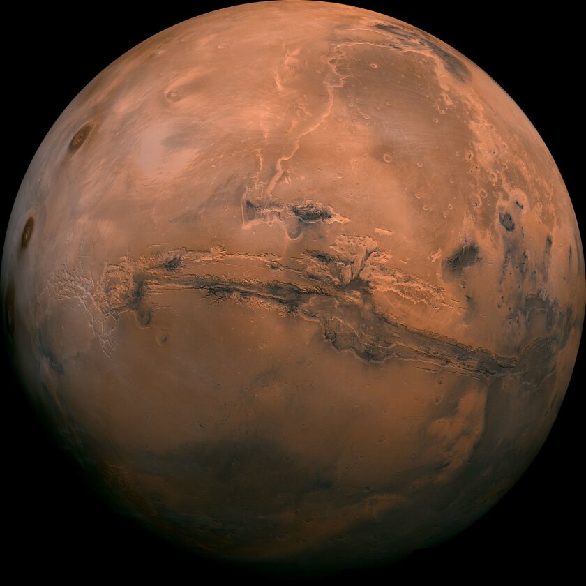 This image made available by NASA shows the planet Mars. This composite photo was created from over 100 images of Mars taken by Viking Orbiters in the 1970s. On Tuesday, July 31, 2018, the red planet will make its closest approach to Earth in 15 years.