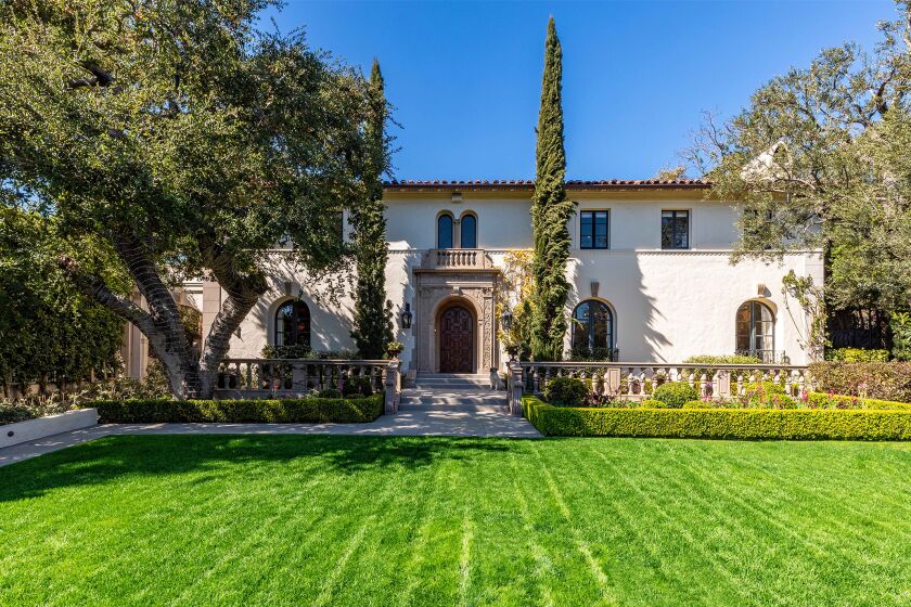 Built in 1929, the architectural gem spans 11,500 square feet with six bedrooms, nine bathrooms and a plush red screening room.