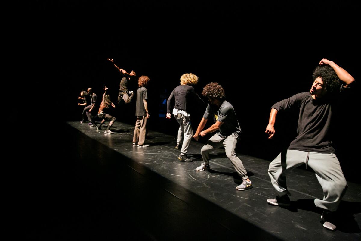 Tiago Sousa, foreground, and other dancers from Companhia Urbana de Dança rehearse "ID: Entidades" on Wednesday at the REDCAT in Los Angeles.
