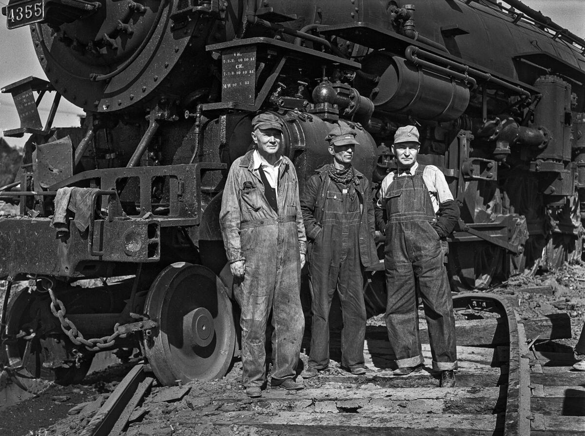 Oct. 19, 1935: From left are firefighter Harry Darms, engineer Arthur Champlin and firefighter D.A. Woodruff. All three men were on the locomotive when it crashed into a seven-ton truck stuck on the tracks in Glendale.