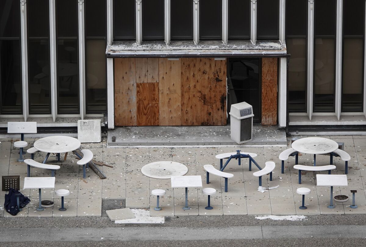 Debris covers a patio area at the former Sempra Energy building at 101 Ash Street in downtown San Diego