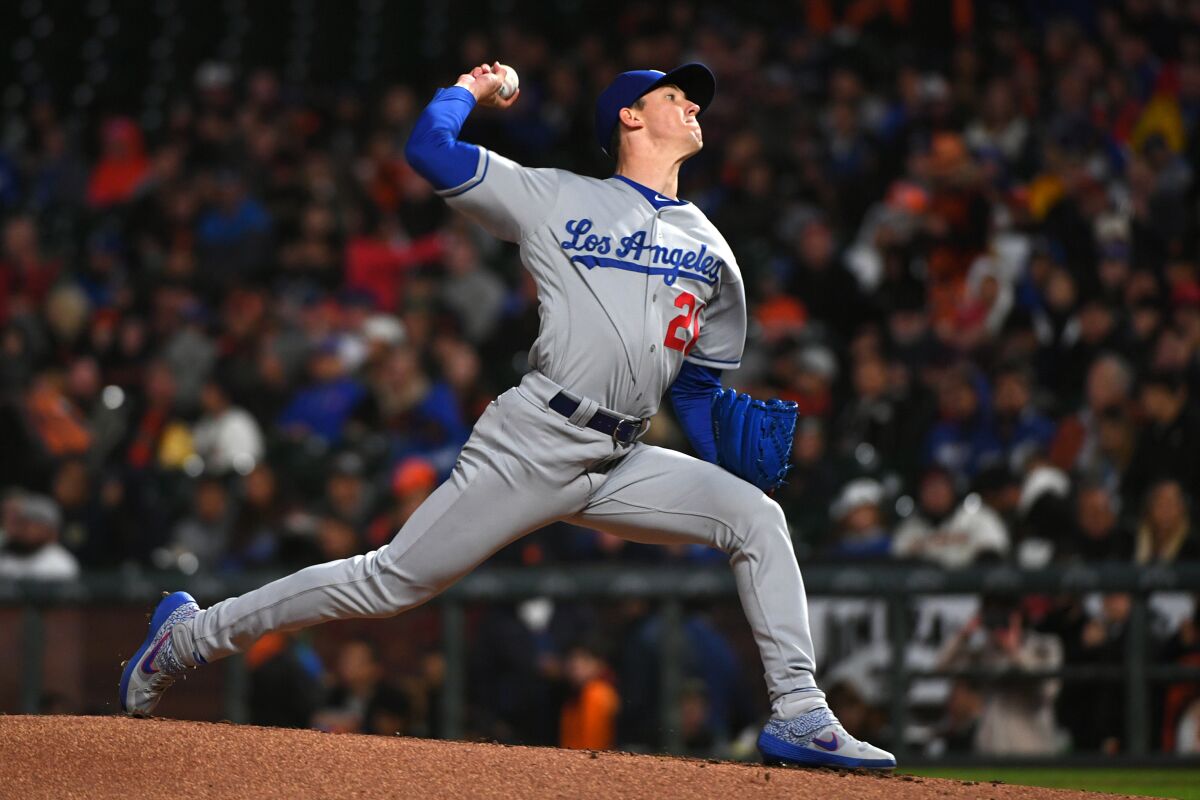 Dodgers pitcher Walker Buehler throws a pitch in the first inning against the Giants on Friday in San Francisco.