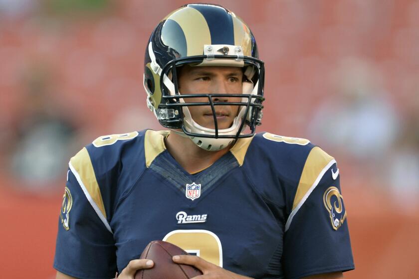 The St. Louis Rams quarterback Sam Bradford warms up before a game against the Cleveland Browns in August 2014. Bradford was traded to the Philadelphia Eagles on Tuesday.