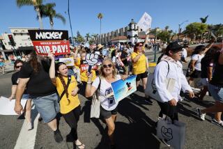 Anaheim, CA - July 17: Over 400 Disney cast members rally outside the Disneyland Main Entrance Ahead of ULP Strike Authorization Vote Disneyland in Anaheim Wednesday, July 17, 2024. The Bakery, Confectionery, Tobacco Workers and Grain Millers (BCTGM) Local 83, SEIU-United Service Workers West (SEIU-USWW), Teamsters Local 495 and the United Food and Commercial Workers (UFCW) Local 324, together representing 14,000 cast members at Disneyland, Disney California Adventure, Downtown Disney and the Disney hotels, rally outside the main entrance to Disneyland Resort two days prior to holding a vote to authorize an Unfair Labor Practice strike. Strikers say the strike authorization vote follows unfair labor practices alleging hundreds of labor violations by Disney throughout negotiations that have interfered with the Unions getting the fair contract cast members deserve. (Allen J. Schaben / Los Angeles Times)