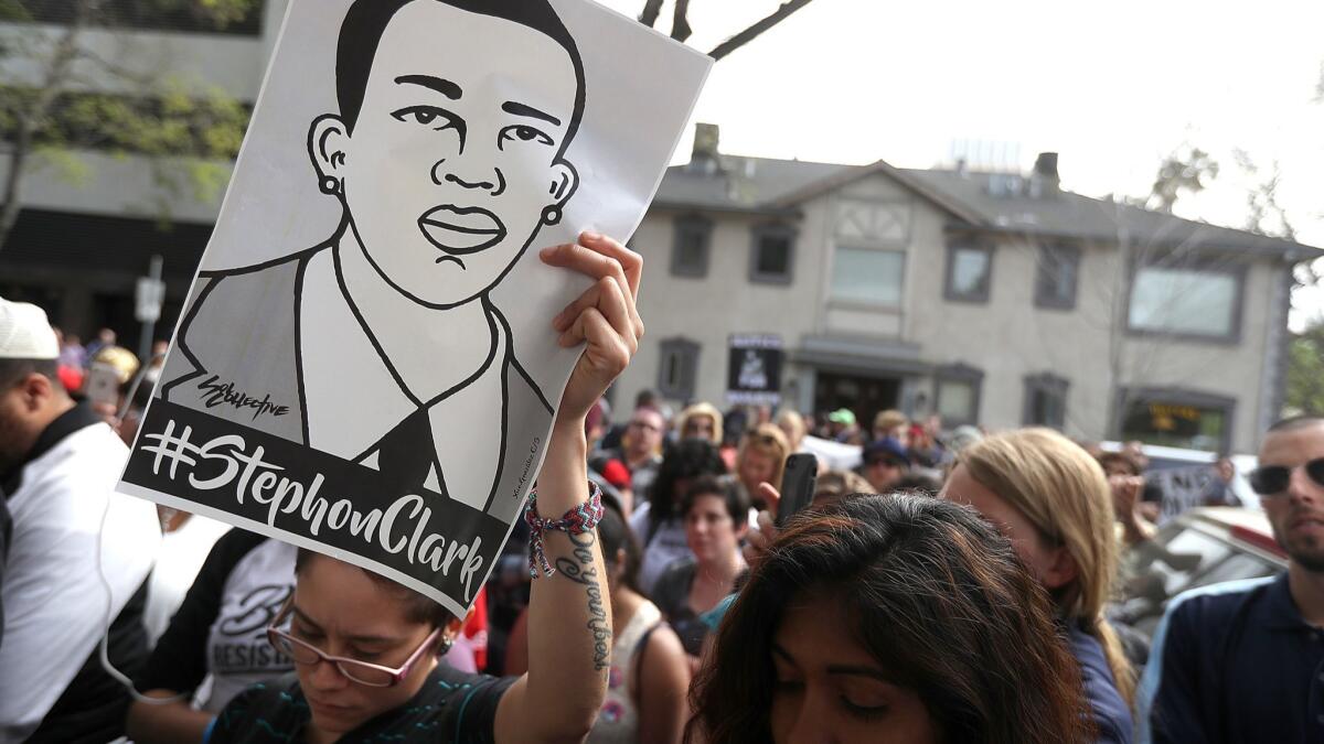 Black Lives Matter protesters stage a demonstration in front of the offices of Sacramento district attorney Anne Marie Schubert on April 4.