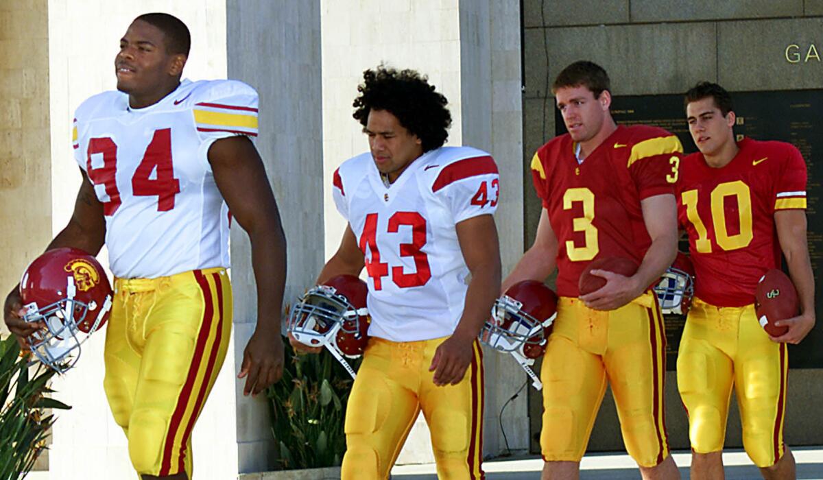 In 2002, USC unveiled new football jerseys with four future NFL players -- from left, Kenechi Udele, Troy Polamalu, Carson Palmer and Matt Cassel. It was the first change since 1971.