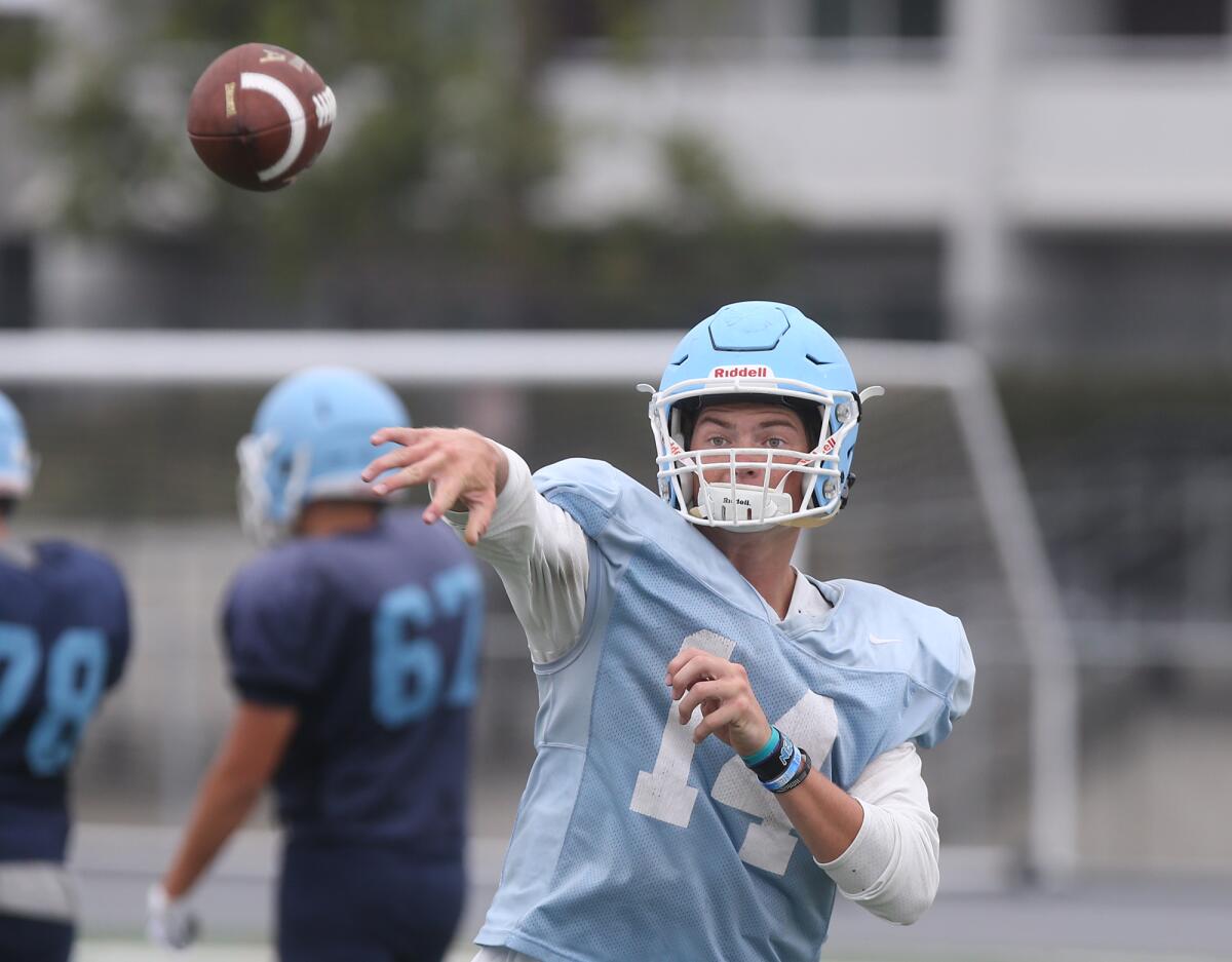 Ethan Garbers, seen throwing a pass during Corona del Mar's practice on Aug. 8, passed for 4,135 yards and 55 touchdowns in 2018.