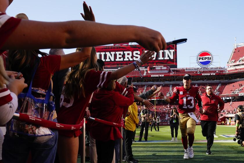 San Francisco 49ers quarterback Brock Purdy (13) greets fans after an NFL football game against the Arizona Cardinals in Santa Clara, Calif., Sunday, Oct. 1, 2023. (AP Photo/Godofredo A. Vásquez)